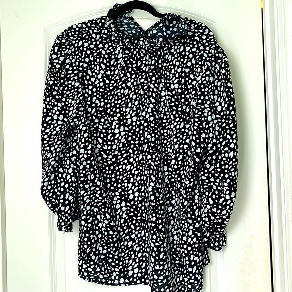 Large tunic length black and white print blouse with ruffle neck